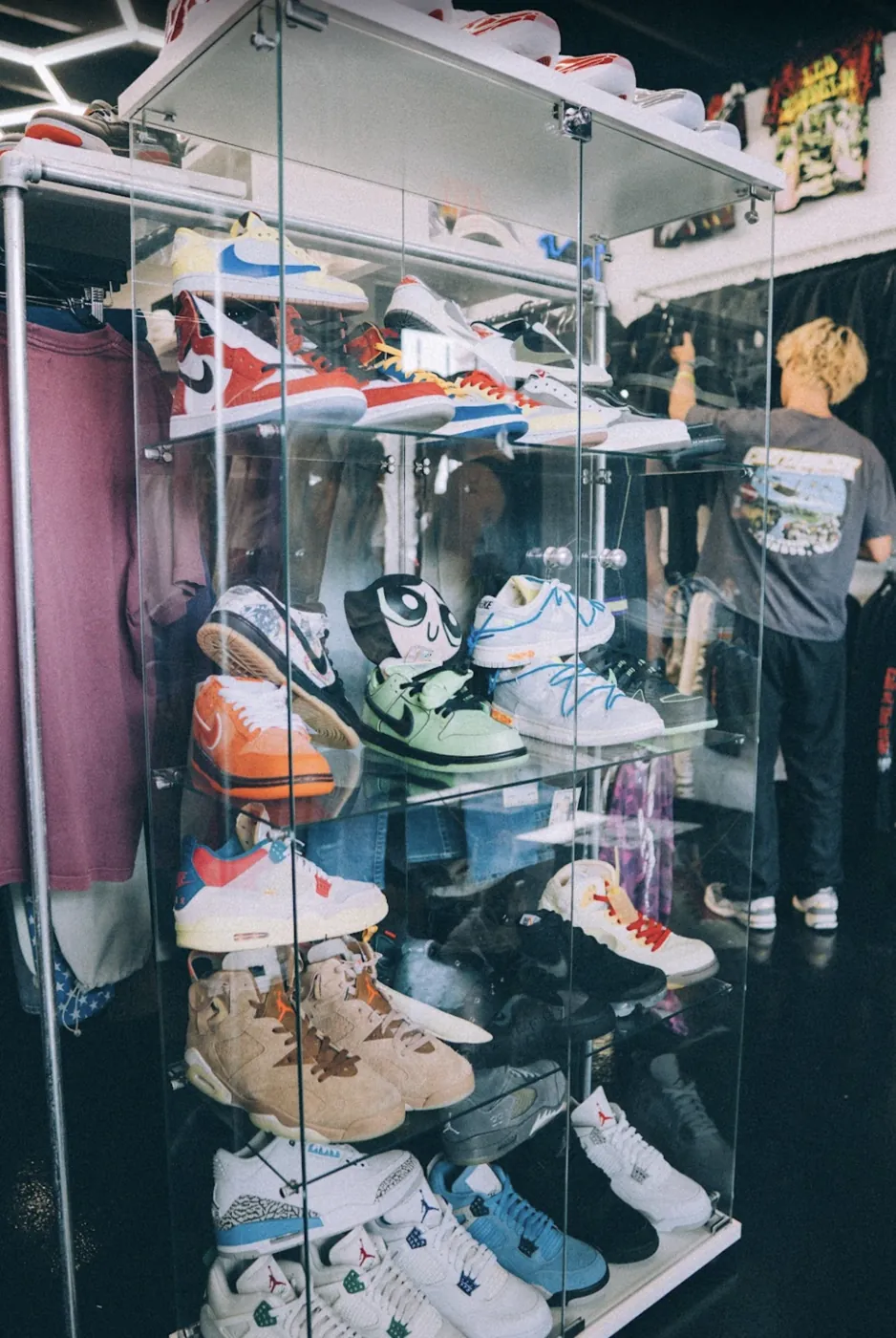 Glass case of Dunks and Jordans inside A-List Tulsa
